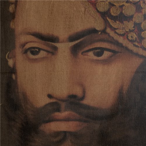 Portrait of Maharaja Udaipur with sculpted wooden frame