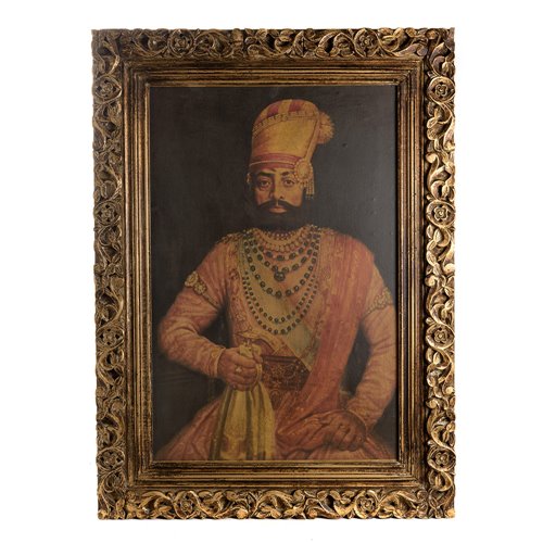Portrait of Maharaja Takhat Singh sitting with sculpted wooden frame