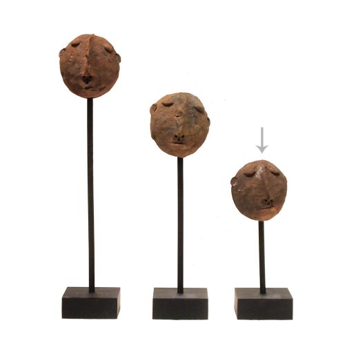 Mask in clay on stand